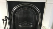 arched fireguard black surround white fireplace